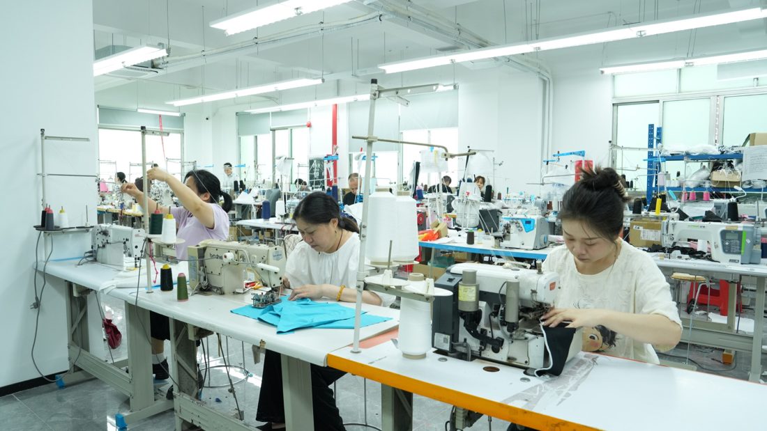 MIDYOGA sample room with sewing machines and activewear development work