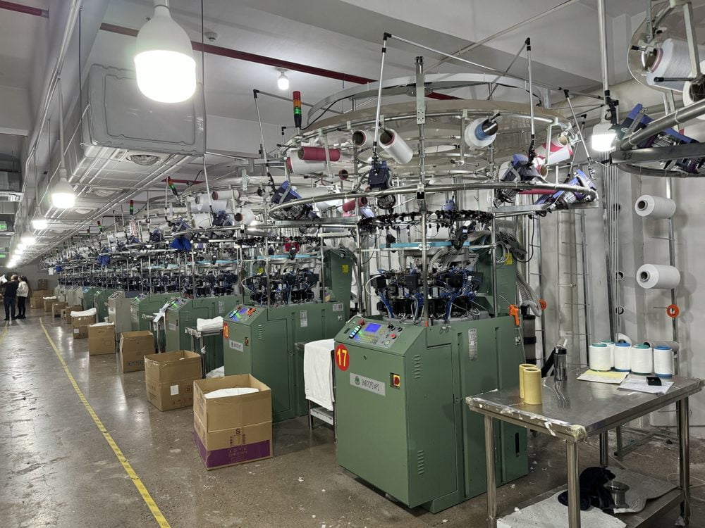 Rows of circular knitting machines in the seamless workshop